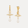 Gold earrings with pearl drops on a white background