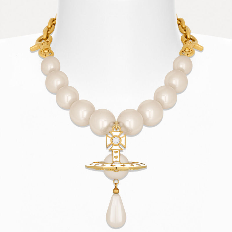 Pearl necklace with gold accents on a white background