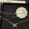 Chanel necklace with bow detail on a Chanel box