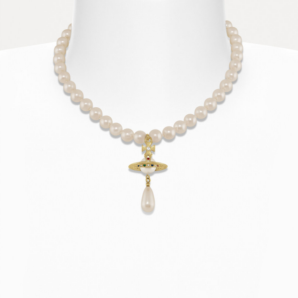 Pearl necklace with a gold cross pendant on a white background