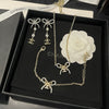Jewelry set with necklace and earrings on a Chanel box