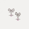 Pair of earrings with bow designs and pink beads on a white background